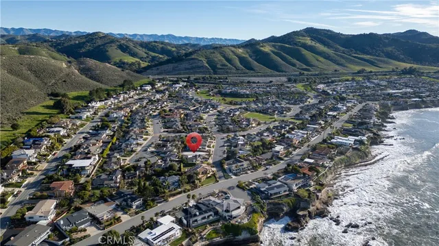 a view of swimming pool with a patio and a yard