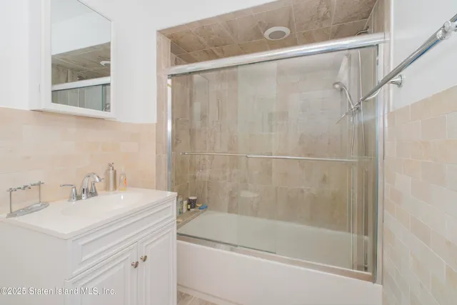 a bathroom with a bathtub and a sink