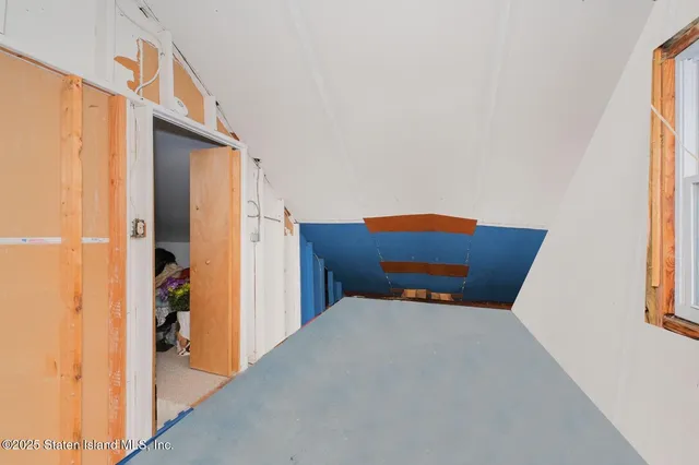 a bedroom with furniture and window