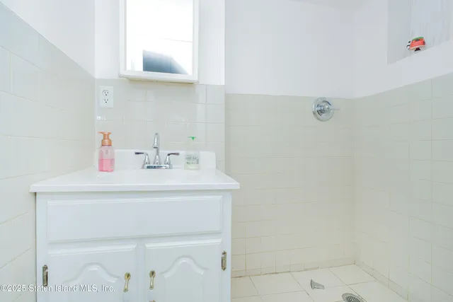 a bathroom with a sink a vanity and a mirror