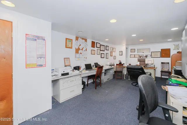 a living room with furniture and a piano