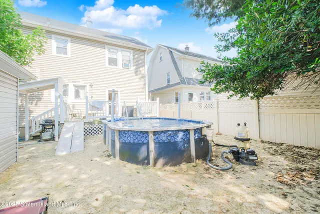 a room with patio entrance and a table and chairs