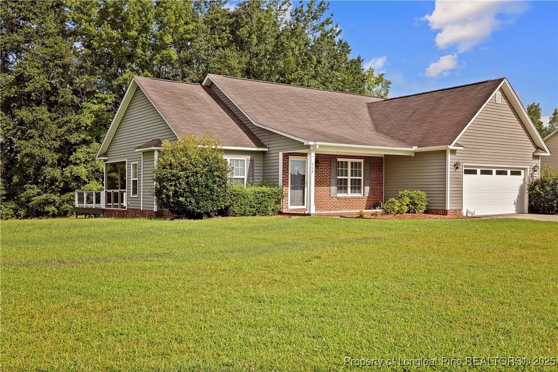 a view of a house with garden and yard