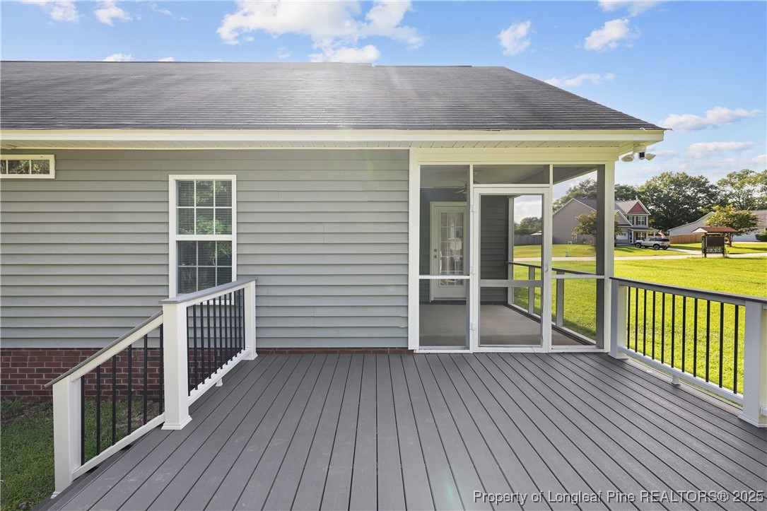 203 United Road Raeford, NC 28376 - Photo 26 of 36 a view of a house with a deck