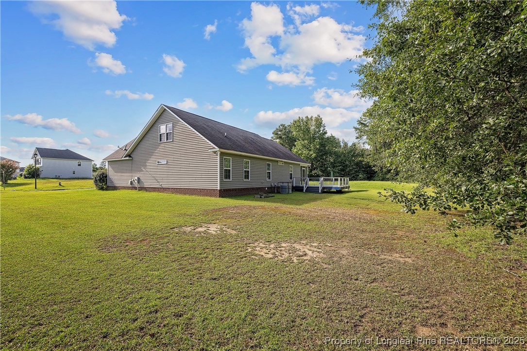 203 United Road Raeford, NC 28376 - Photo 28 of 36 a view of an house with backyard space and balcony