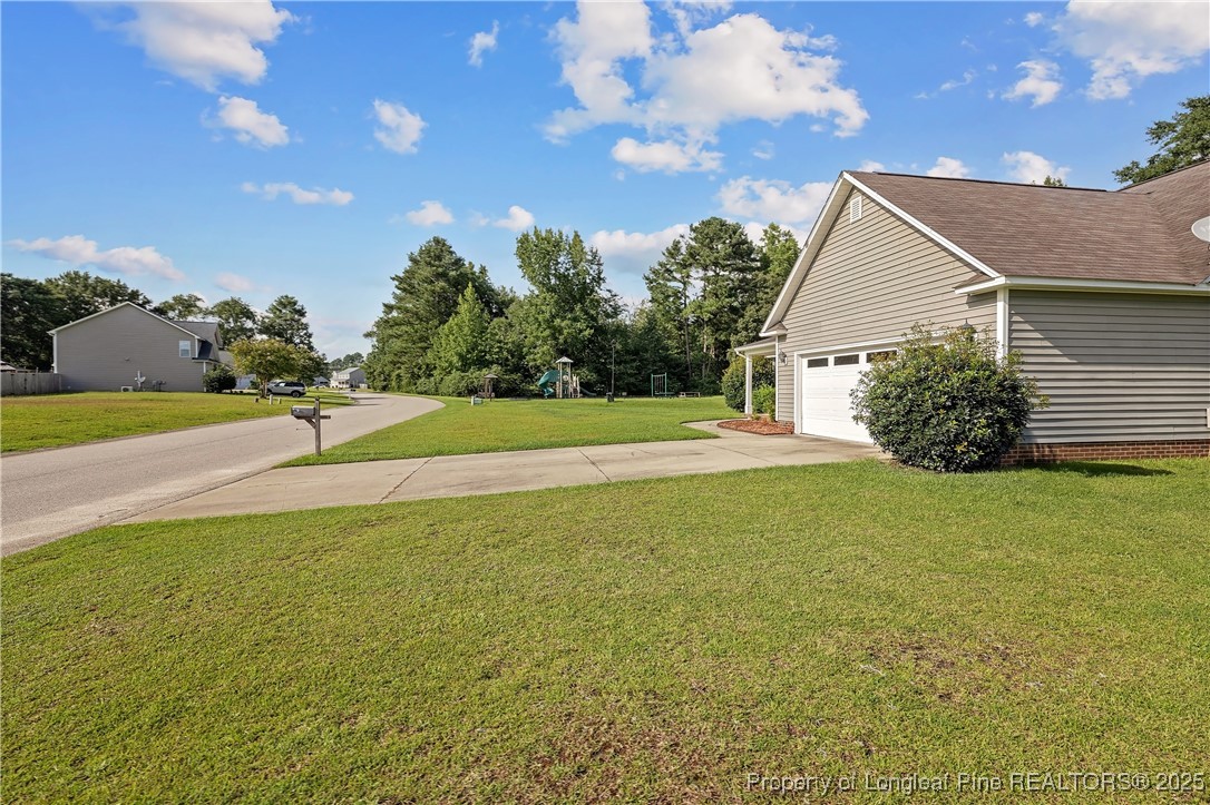 203 United Road Raeford, NC 28376 - Photo 31 of 36 a backyard of a house with lots of green space