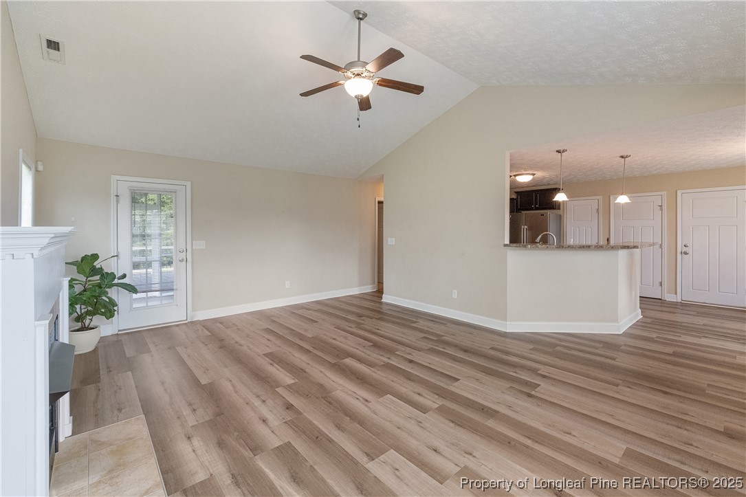 203 United Road Raeford, NC 28376 - Photo 6 of 36 a view of a kitchen with furniture and a ceiling fan