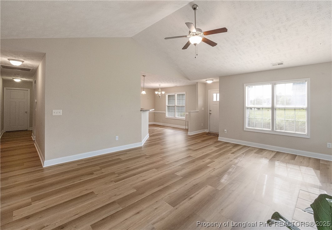 203 United Road Raeford, NC 28376 - Photo 7 of 36 a view of an empty room with wooden floor and a window