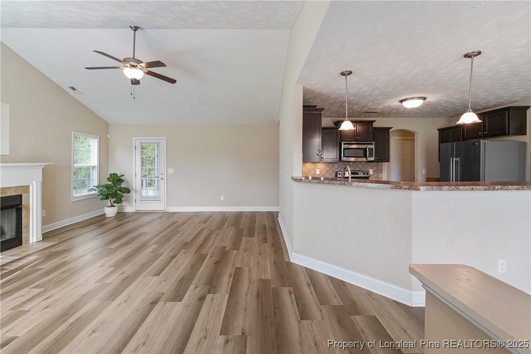 203 United Road Raeford, NC 28376 - Photo 8 of 36 a view of a living room and chandelier fan