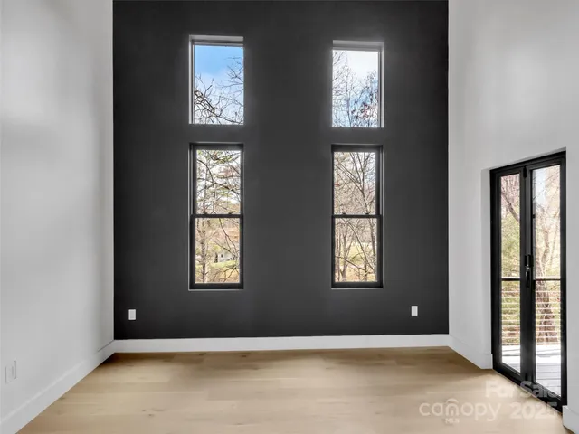 a view of an empty room with windows