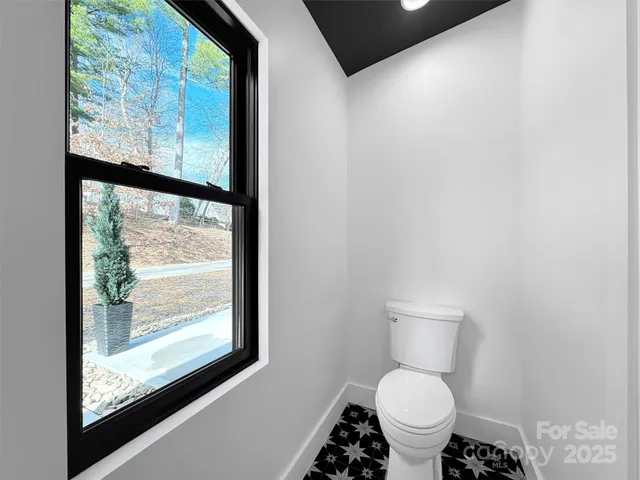 a view of a wooden house with a yard