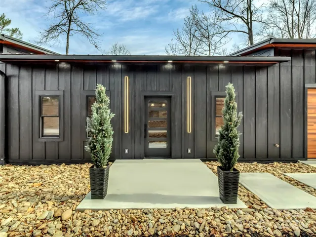 a view of a park with large trees