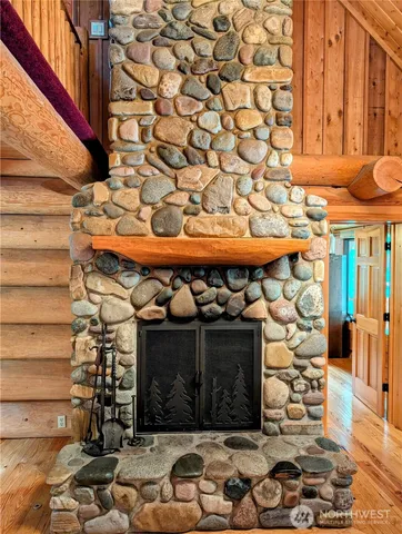 a room with water heater and wooden walls