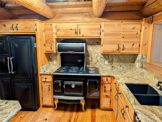 a view of living room with furniture and a fireplace