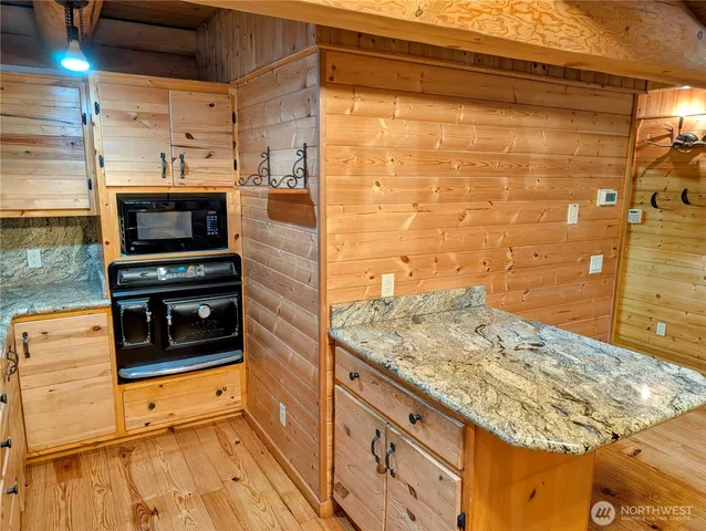 a view of kitchen with microwave and stove