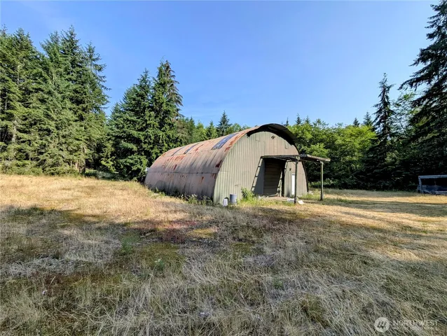 a living room with lots of furniture and a chandelier