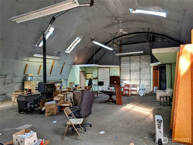 a view of a yard and a house with a tree