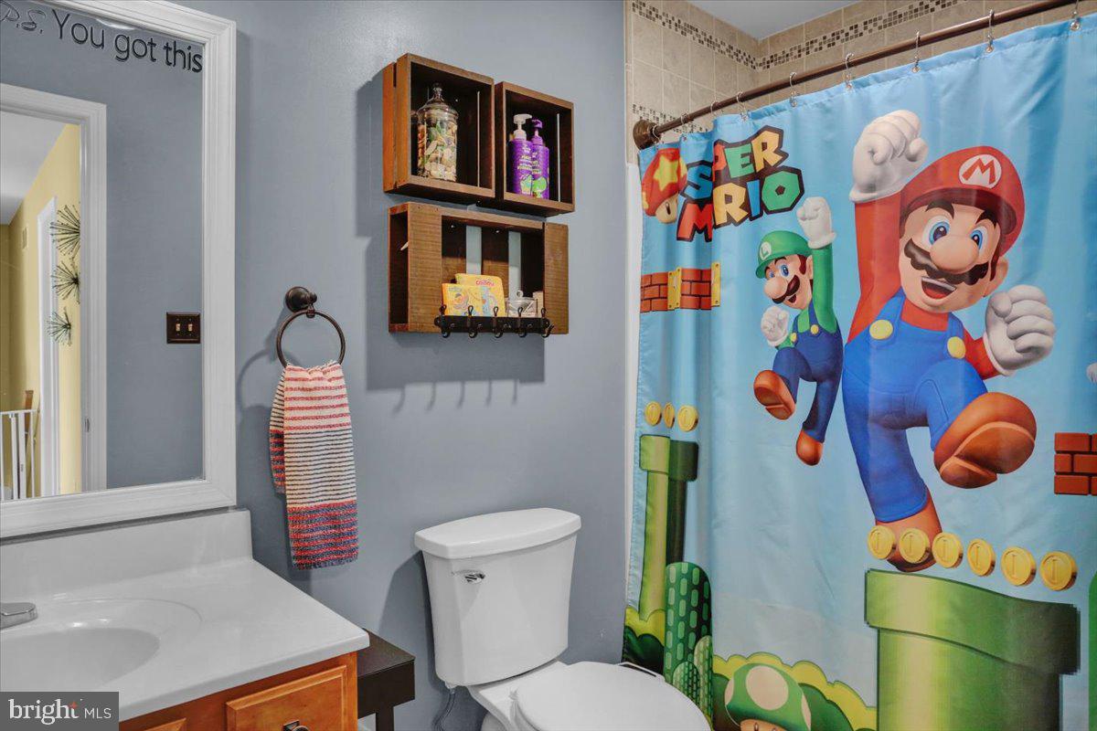 7 Kantner Lane North Reading, PA 19607 - Photo 36 of 50 a bathroom with a sink a toilet and curtain