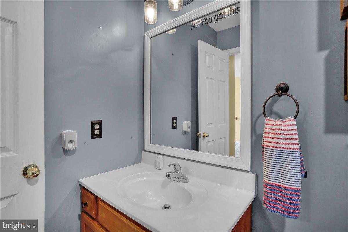 7 Kantner Lane North Reading, PA 19607 - Photo 37 of 50 a bathroom with a sink and mirror