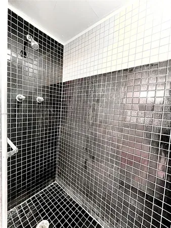 a white toilet sitting next to a bathroom sink