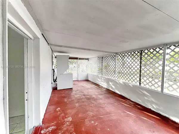 a view of a big room with windows and cabinet