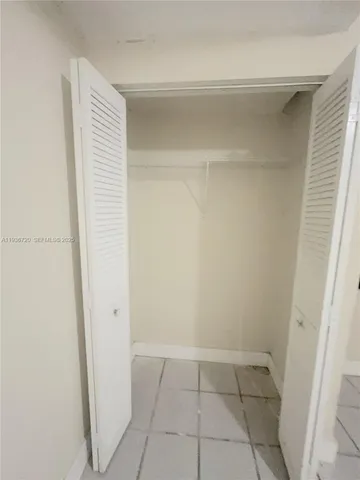 a close view of an empty walk in closet