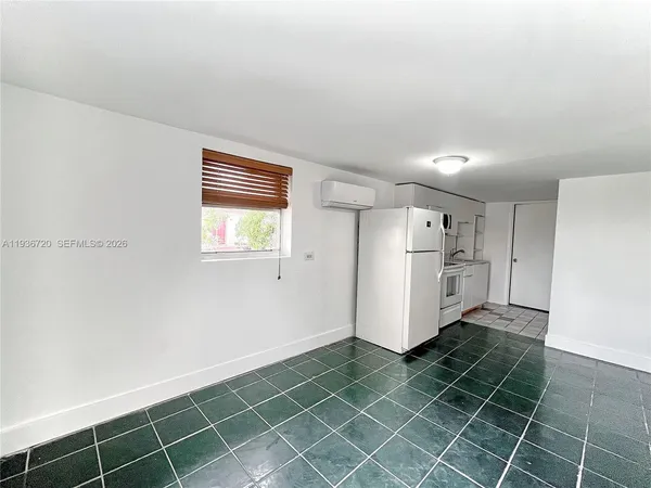 a kitchen with stainless steel appliances white cabinets and white appliances