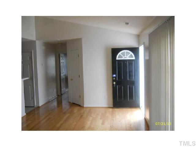 9027 Shallcross Way Raleigh, NC 27617 - Photo 3 of 6 a room with a bench in it