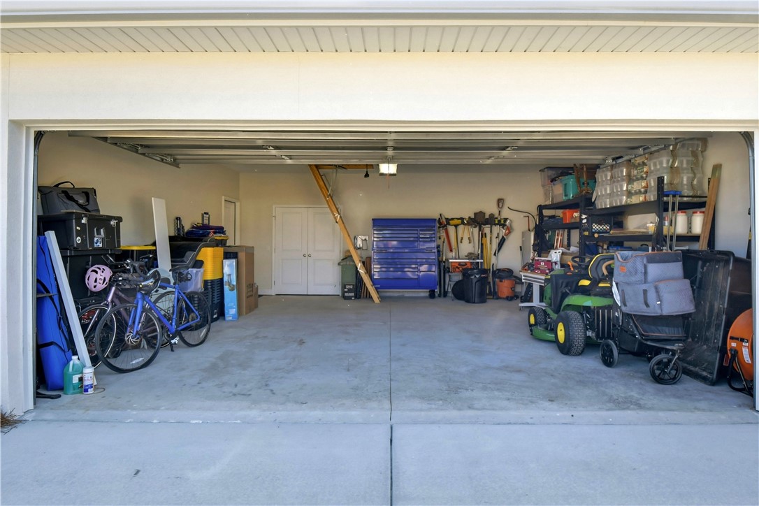 18 Edenham Court Brunswick, GA 31523 - Photo 32 of 32 Roomy Two car garage with extra storage behind the double doors