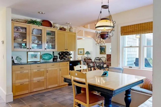 a view of a dining room with furniture and window
