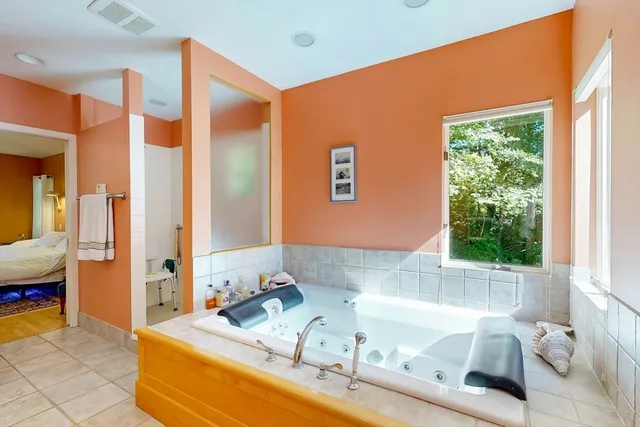 a bath room with a bath tub and a sink