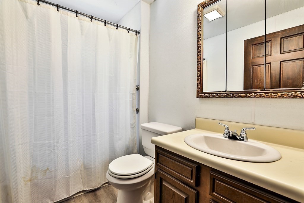 54 Meadowbrook Road Chelmsford, MA 01863 - Photo 11 of 32 a bathroom with a sink and a toilet