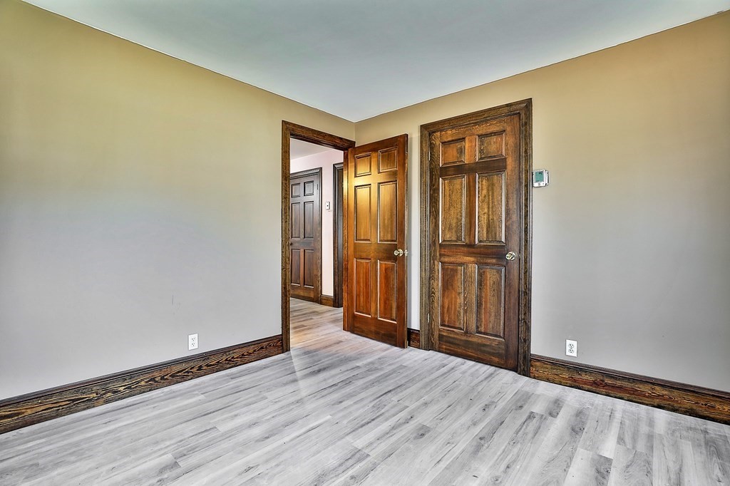 54 Meadowbrook Road Chelmsford, MA 01863 - Photo 15 of 32 a view of an empty room with wooden floor and a window