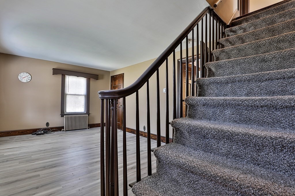 54 Meadowbrook Road Chelmsford, MA 01863 - Photo 16 of 32 a view of staircase with wooden floor and a window