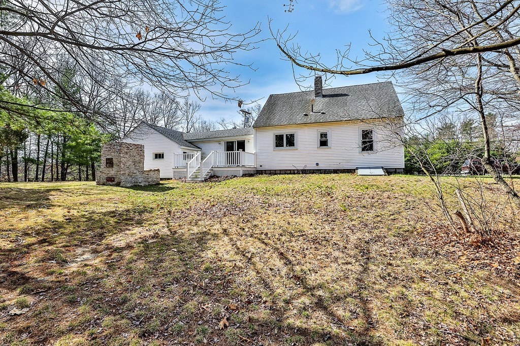 54 Meadowbrook Road Chelmsford, MA 01863 - Photo 27 of 32 a front view of a house with a yard