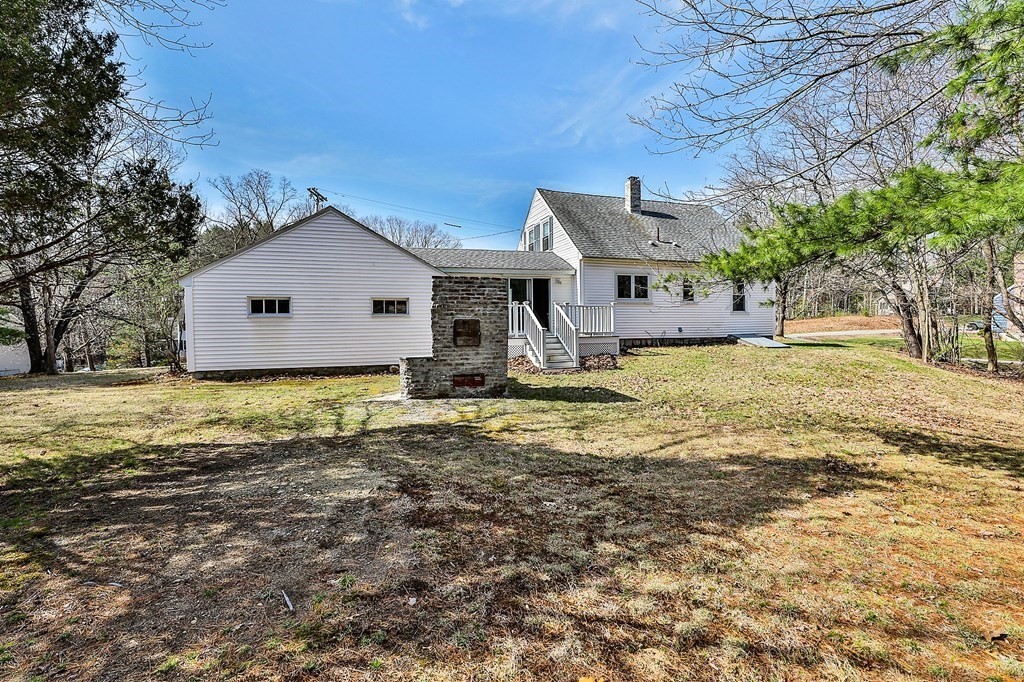 54 Meadowbrook Road Chelmsford, MA 01863 - Photo 28 of 32 a front view of a house with a yard