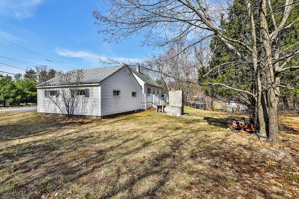 54 Meadowbrook Road Chelmsford, MA 01863 - Photo 29 of 32 a view of a house with a yard