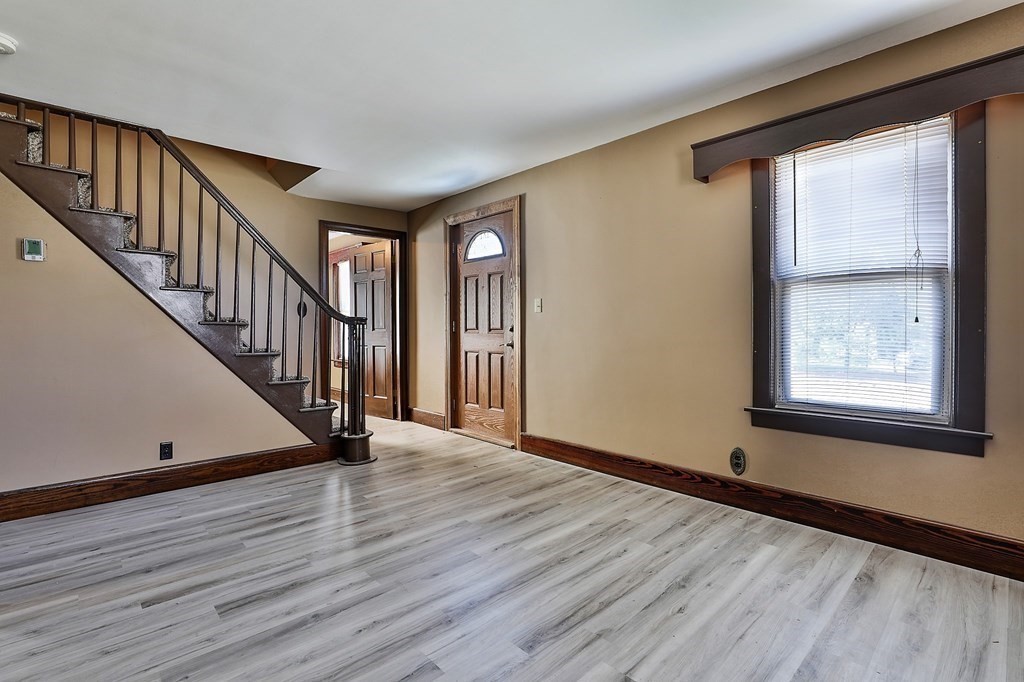 54 Meadowbrook Road Chelmsford, MA 01863 - Photo 3 of 32 a view of an entryway with wooden floor and door