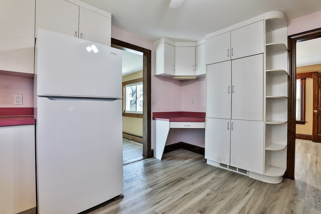 54 Meadowbrook Road Chelmsford, MA 01863 - Photo 7 of 32 a room with stainless steel appliances a refrigerator and a table