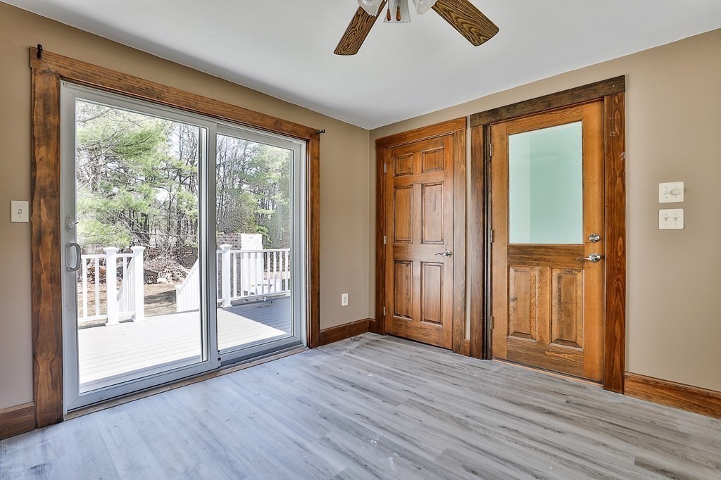 54 Meadowbrook Road Chelmsford, MA 01863 - Photo 9 of 32 a view of empty room with wooden floor and fan