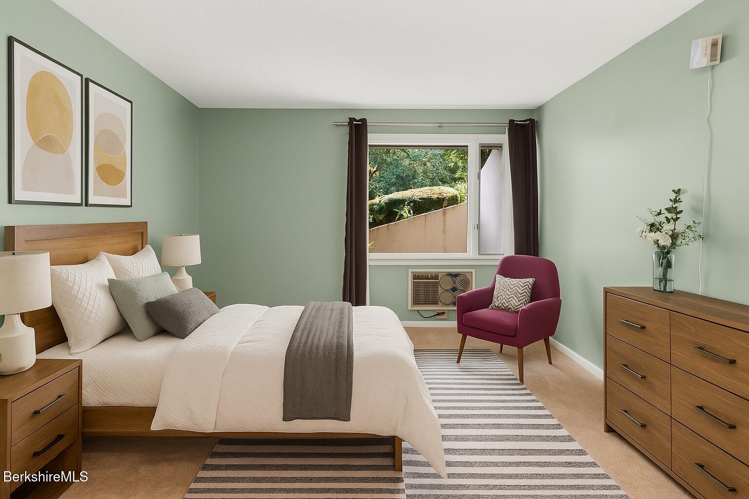 1 Colt Road, Unit 2 Pittsfield, MA 01201 - Photo 12 of 20 a bedroom with a bed and wooden floor