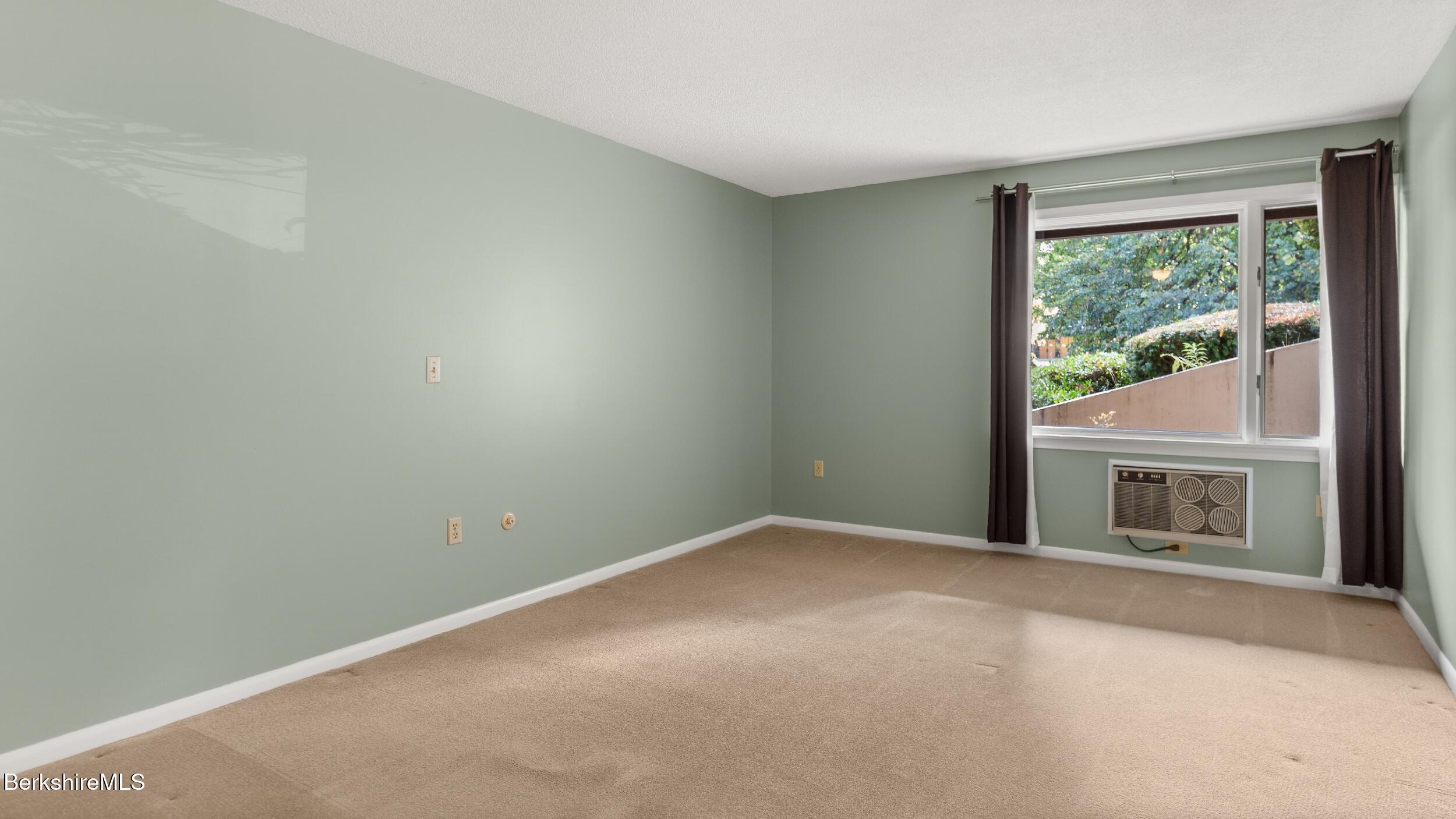 1 Colt Road, Unit 2 Pittsfield, MA 01201 - Photo 14 of 20 an empty room with windows
