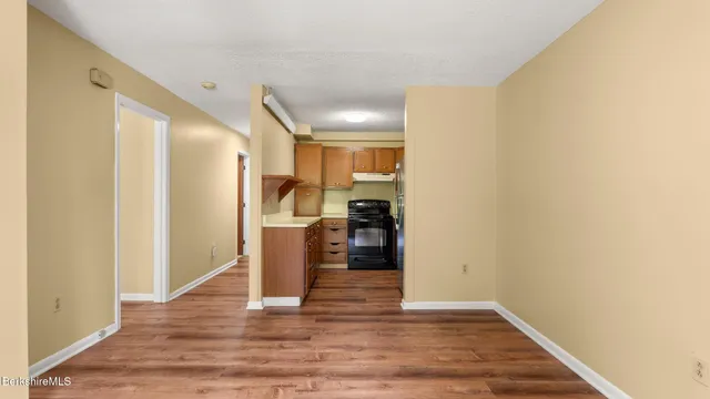 a view of a kitchen cabinets and wooden floor