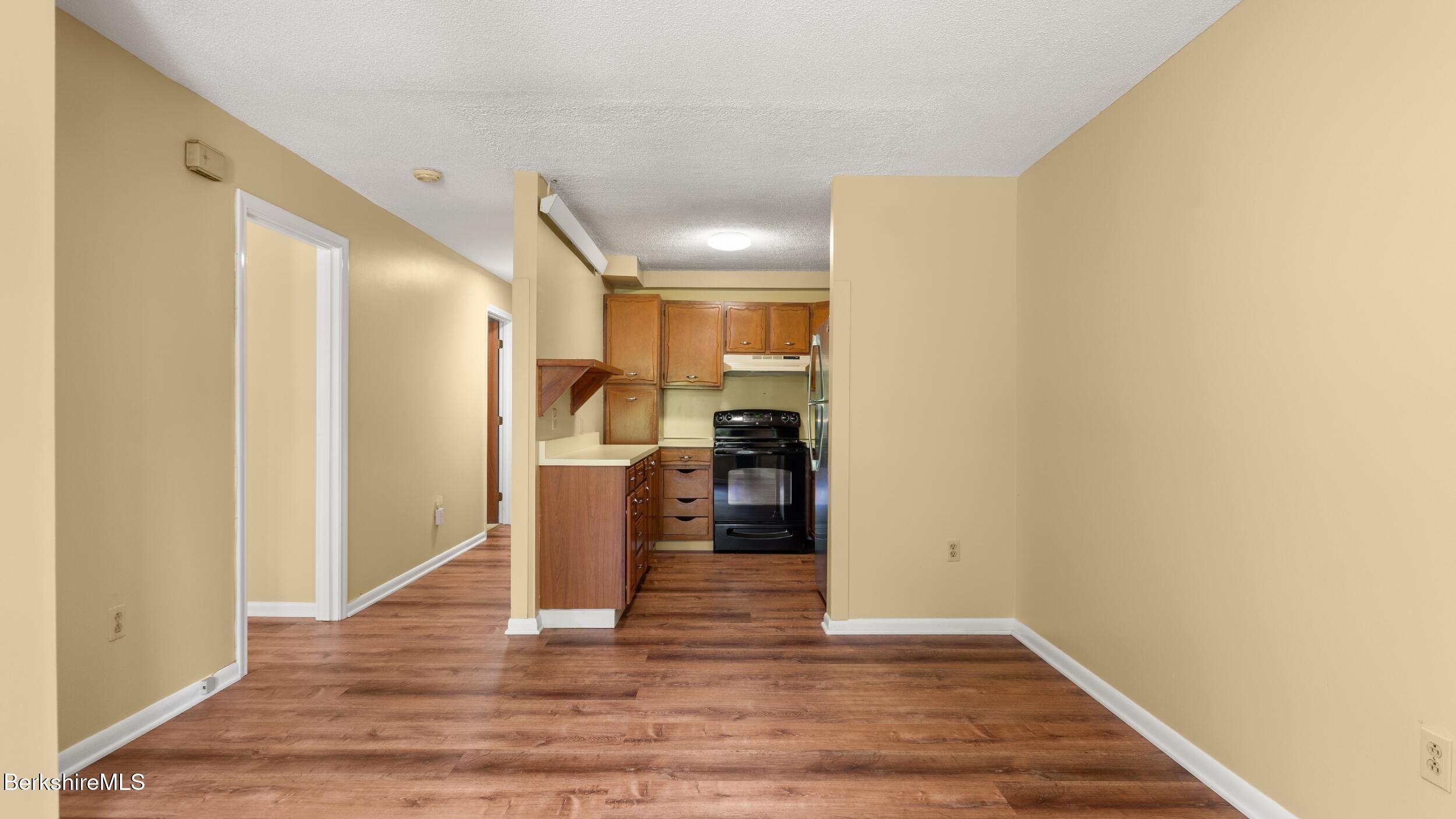 1 Colt Road, Unit 2 Pittsfield, MA 01201 - Photo 8 of 20 a view of a kitchen cabinets and wooden floor