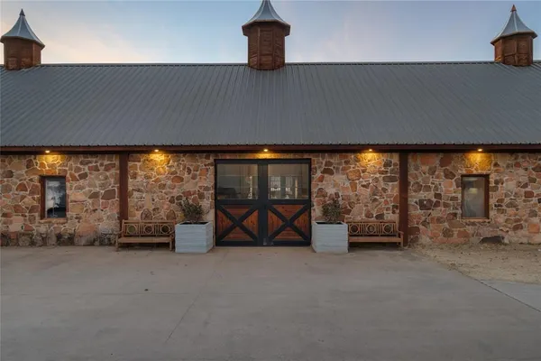 a backyard of a house with table and chairs