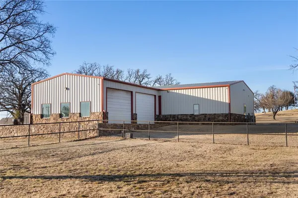 a view of a large room with furniture and wooden floor