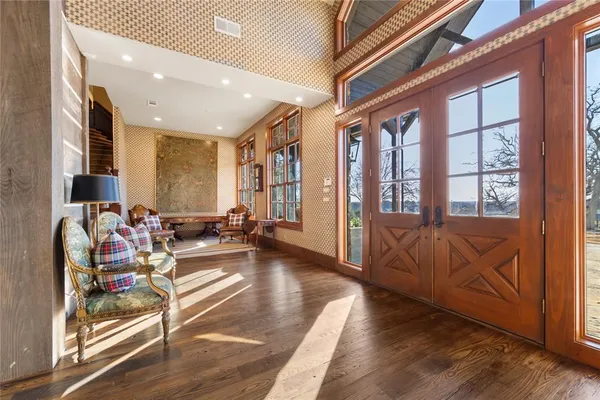 a living room with furniture and a book shelf