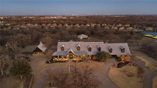 an aerial view of a house with parking space