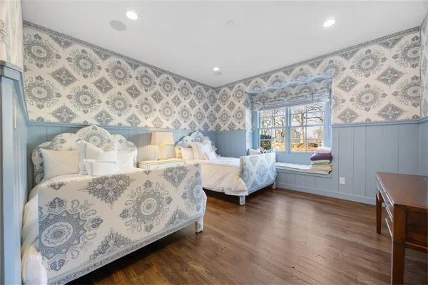 a bedroom with a large bed and a couch