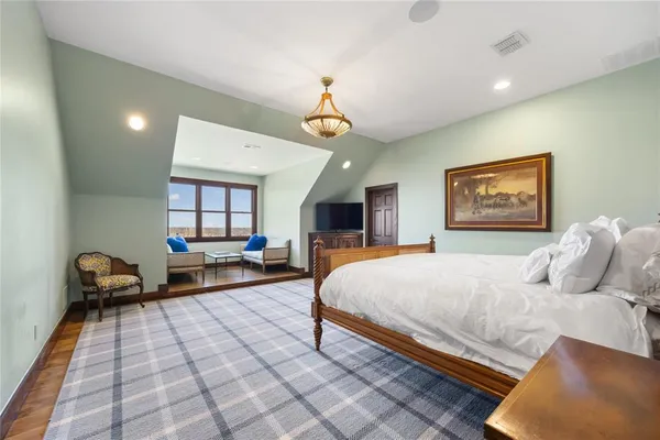 a living room with lots of furniture and lots of wooden furniture